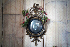 A Regency Period Giltwood & Gesso Convex Mirror Surmounted by an Eagle c.1815