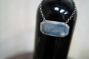 A Silver Decanter Label for 'Poison'; CJ Vander; London 1979