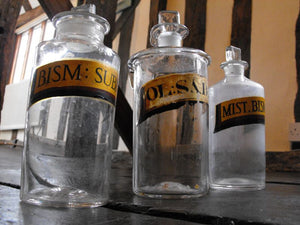 Three Late 19thC Glass Apothecary Bottles with Painted Banners to include one Oleum example for Savin Oil & two for Bismuth