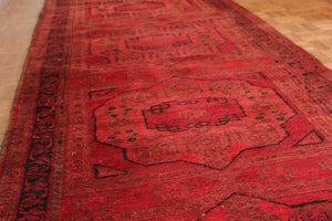 A Large Semi-Old Red Afghan Runner c.1950: 395cm x 95cm