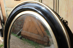 A Decorative c.1880 Ebonised Oval Wall Mirror
