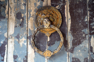 A Large Georgian Style Verdigris Brass Lion’s Mask Door Knocker