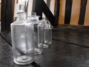 A Quartet of Graduating Late 19thC Plain Glass Apothecary Bottles