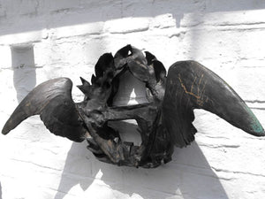 A Unique Cast Bronze Wall Sculpture Formed as a Laurel Wreath Flanked by Spread Wings
