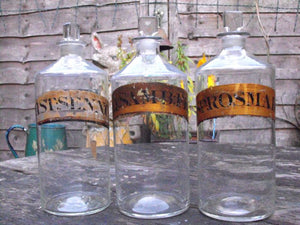 Three 19thC Glass Apothecary Bottles with Painted Gold Banners for Elder Flower Water, Mixture of Senna & Spirit of Rosemary