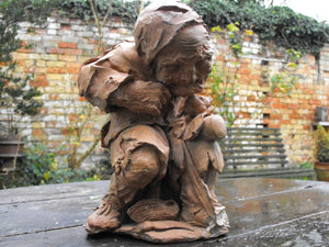 A Unique Terracotta Sculptured Figure of a Hunchbacked Tradesman c.1940
