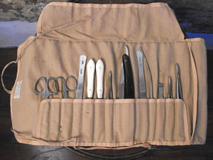A Twelve-Piece Field Surgical Kit, by Flatters & Garnett Ltd of Manchester, supplied by S Rampling of Market St, Cambridge