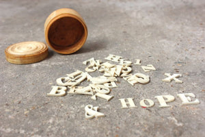 A Fine c.1860 Collection of Carved Bone Alphabet Letters Within a Turned Ivory Box