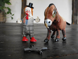 Two pieces of Tin Automata; one a Schuco Clown, One An Unmarked Donkey