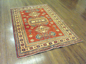 A Good Quality Supreme Afghan Kazak Rug: 179cm x 125cm