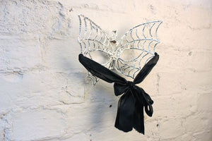A Good Quality Masquerade Ball Mask in the Form of Butterfly Wings with Skull Decoration