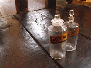 Two Late 19thC Glass Apothecary Bottles with Painted Gold Banners, One for Sodium Sulphate