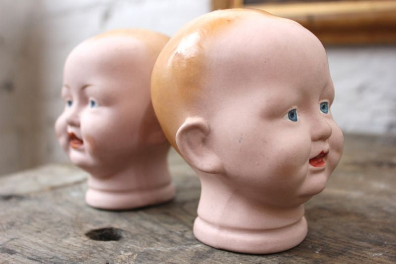 A Good Pair of Early 20thC Bisque Baby Doll Heads by The Diamond